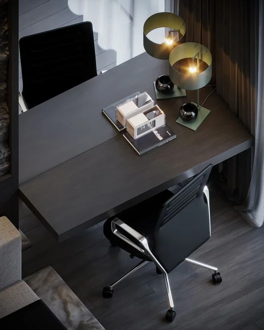 A laptop on a bed showing web design software, creating a cozy workspace.